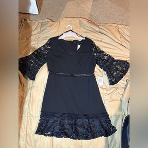 Lace black dress with ruffled sleeve